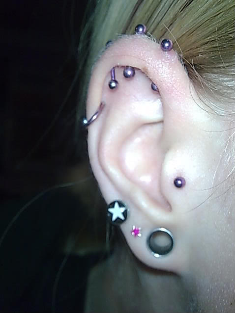 Triple Ear Lobes And Double Conch Piercing For Girls