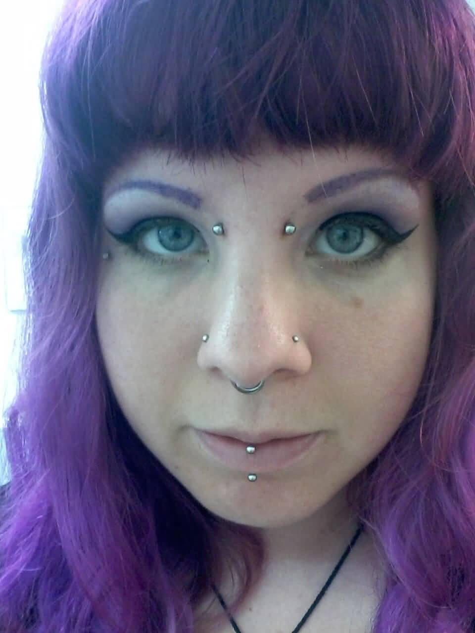 Vertical Labret, Septum And Earl Piercing