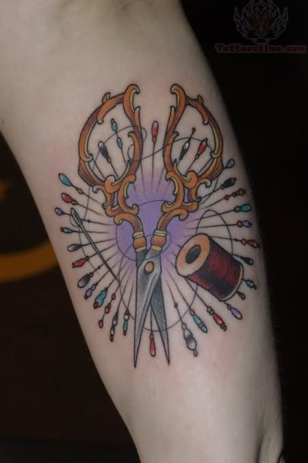 Vintage Scissor With Spool And Needle Tattoo On Arm