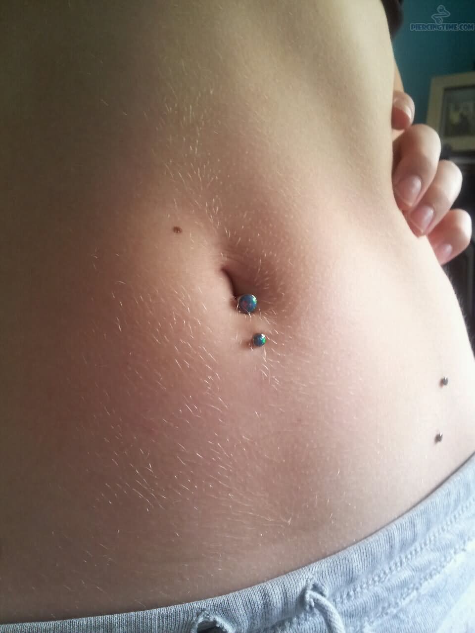 Blue Opal Barbell Inverse Belly Piercing