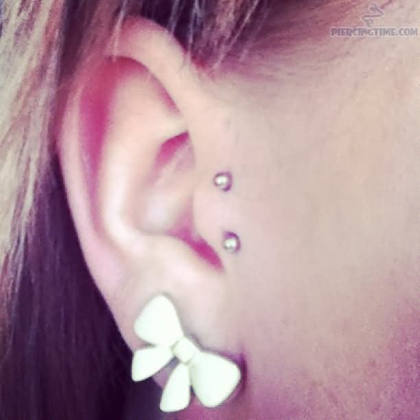 Bow Stud Ear Lobe And Surface Tragus Piercing