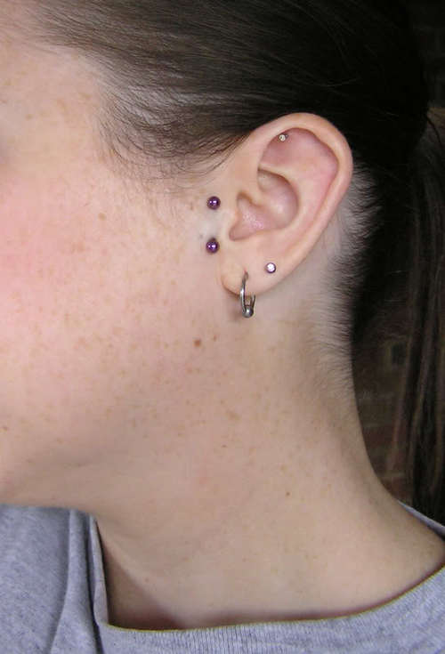 Double Lobe And Surface Tragus Piercing