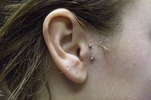 Girl Right Ear Surface Tragus Piercing