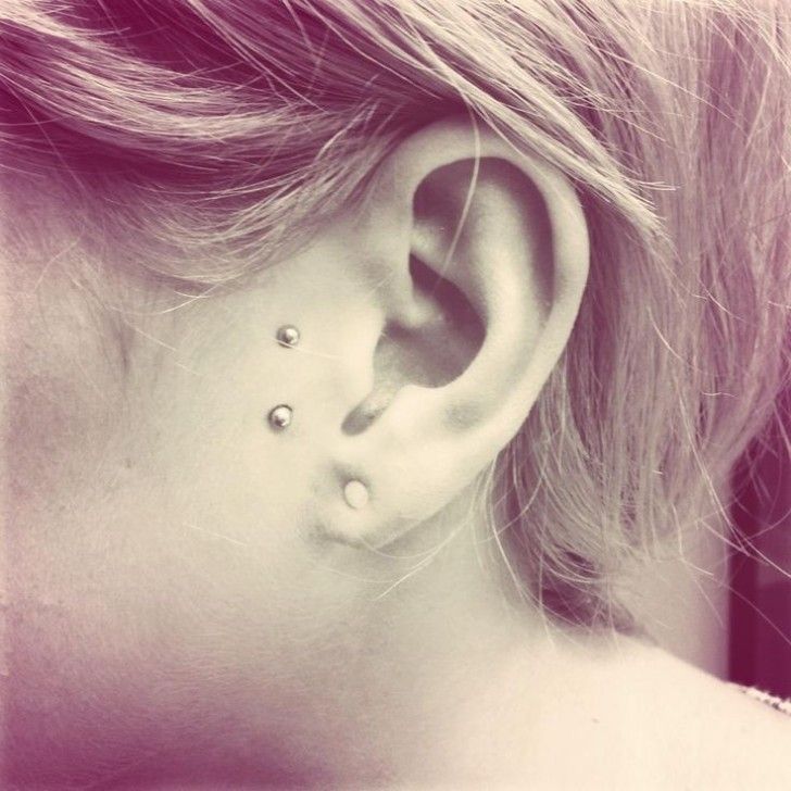 Girl With Single Lobe and Surface Tragus Piercing