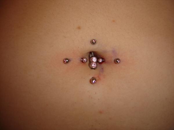 Horizontal Navel Piercing With Opal Barbells