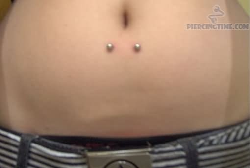 Horizontal Navel Piercing With Silver Barbell