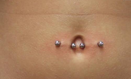 Horizontal Navel Piercing With Silver Barbells