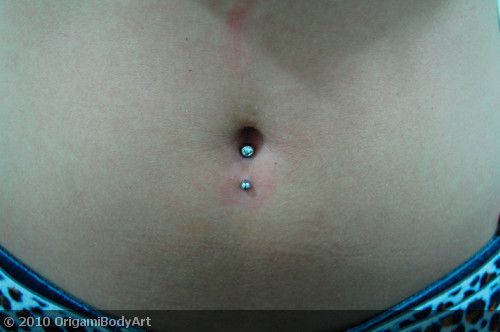 Inverse Belly Piercing With Blue Navel Stud