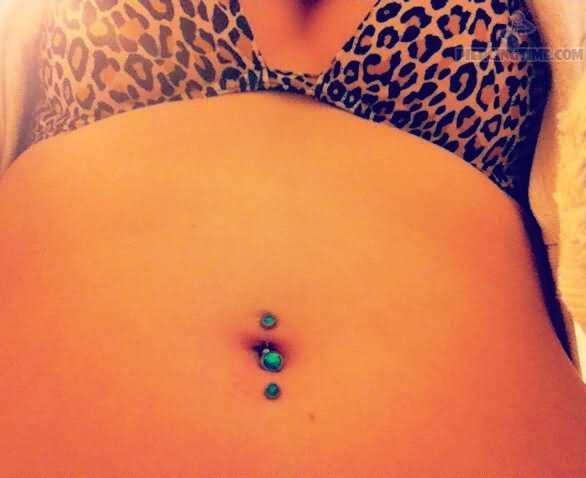 Inverse Belly Piercing With Green Barbells