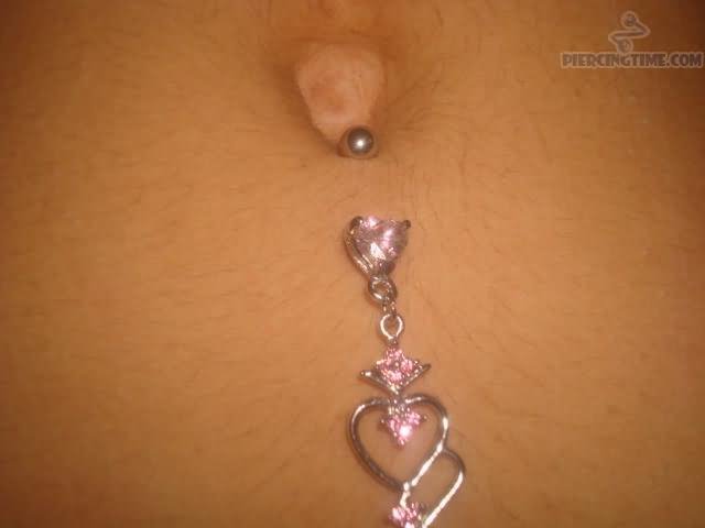 Inverse Belly Piercing With Heart Ring