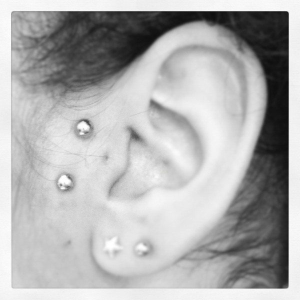 Left Ear Dual Lobe And Surface Tragus Piercing