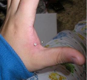 Left Hand Web Piercing Picture