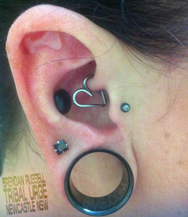 Lobe Stretching And Implants Piercing On Right Ear