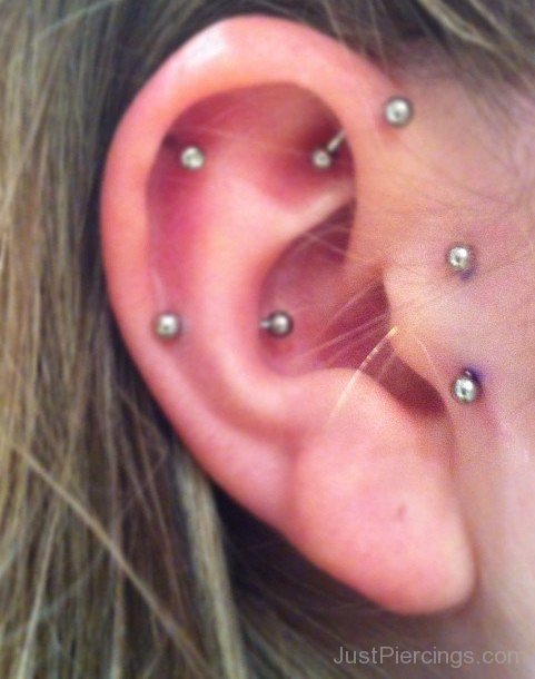 Right Ear Rook And Surface Tragus Piercing