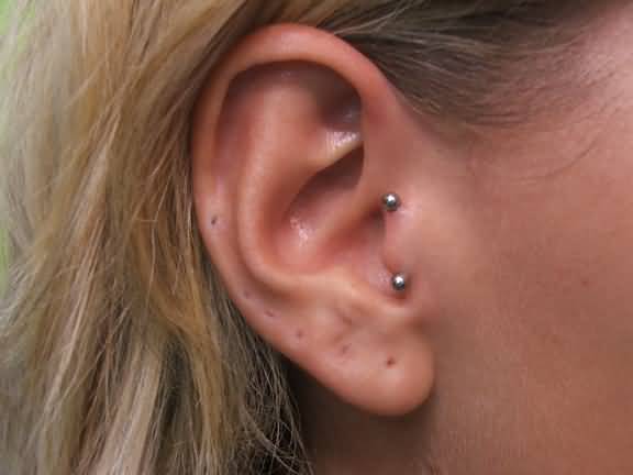 Right Ear Silver Barbell Surface Tragus Piercing