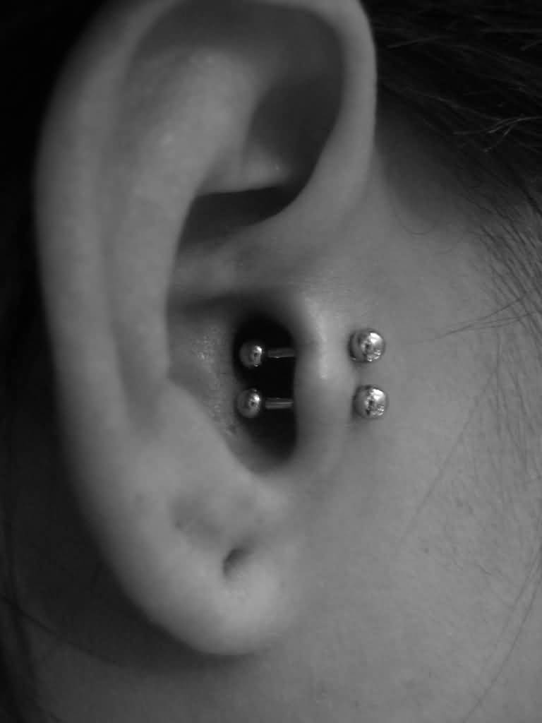 Surface Tragus Piercing With Silver Barbells