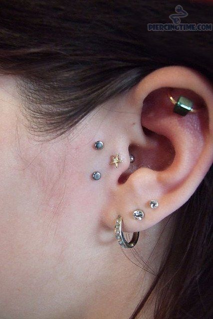 Triple Ear Lobes And Surface Tragus Piercing