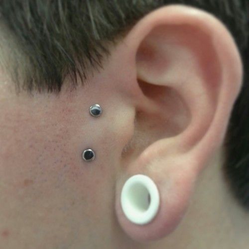 White Gauge Lobe And Surface Tragus Piercing