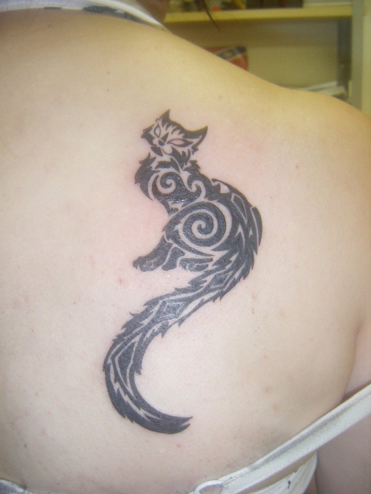 Black Tribal Cat With Long Tail Tattoo On Back Shoulder For Girls