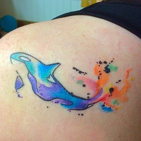 Blue Dolphin With Vivid Color Tail Watercolor Tattoo On Shoulder Blade