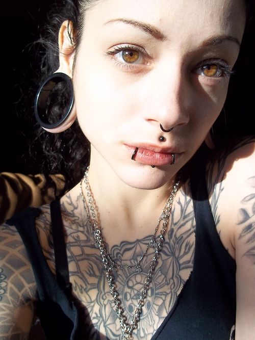 Girl With Face Piercings And Stretched Lobe Piercing