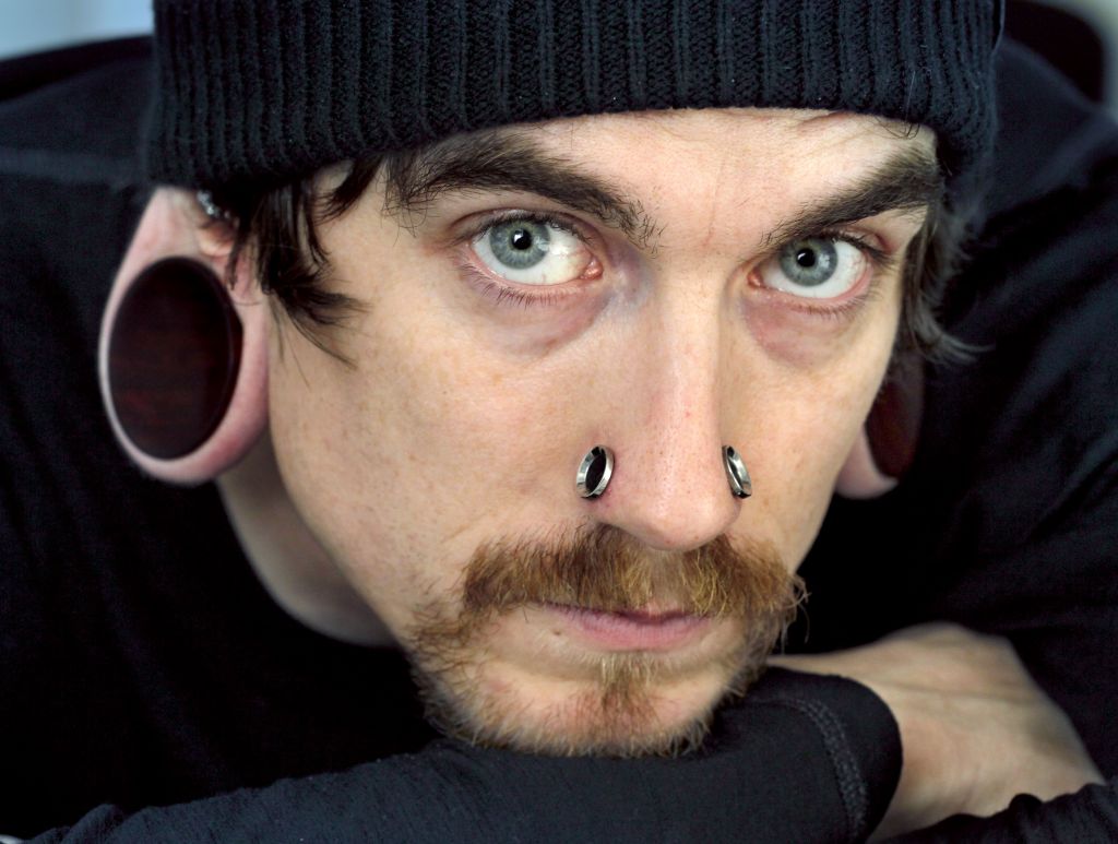 Man With Nose And Stretched Lobe Piercing