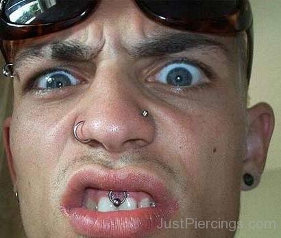 Right Nostril And Upper Lip Frenulum Piercing