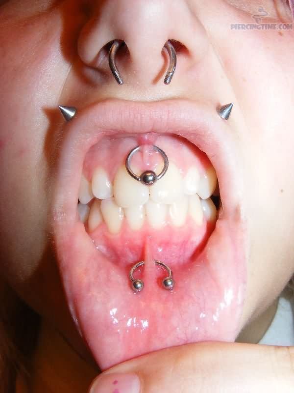 Spike Studs Monroe And Upper And Lower Lips Frenulum Piercings