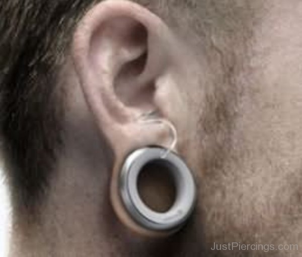 Stretched Lobe Piercing With Metal Gauge