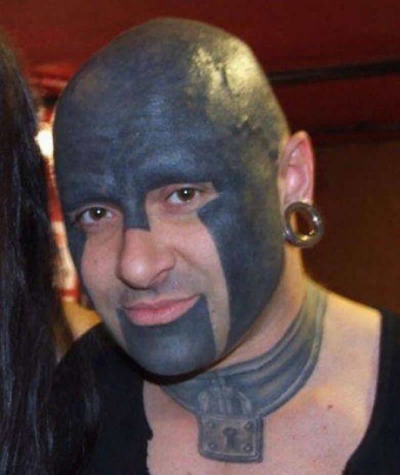 Extreme Black Color Tattoo On Man Face