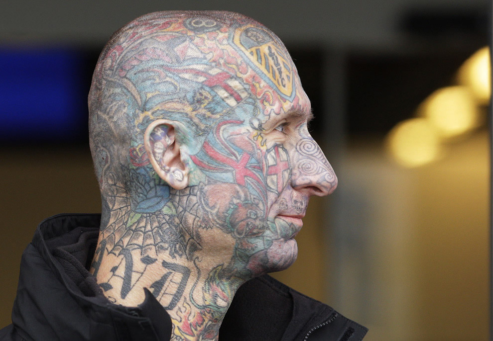 Extreme Colored Tattoo On Man Face