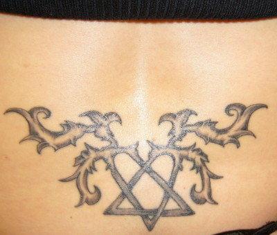 Tribal Heartagram Tattoo On Tailbone