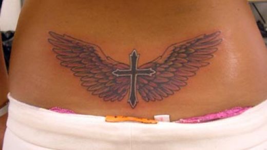 Winged Cross Tailbone Tattoo For Girls