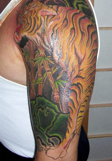 Bamboo Trees And Tiger Tattoo On Left Half Sleeve by Ami James