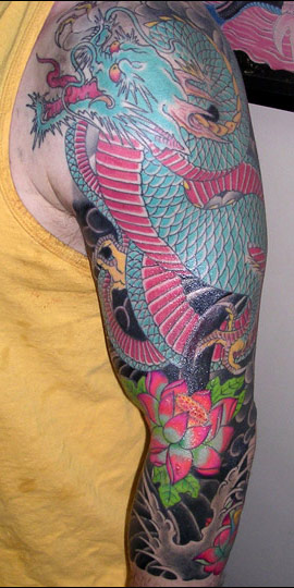 Blue Ink Dragon And Lotus Flowers Japanese Tattoo by Ami James