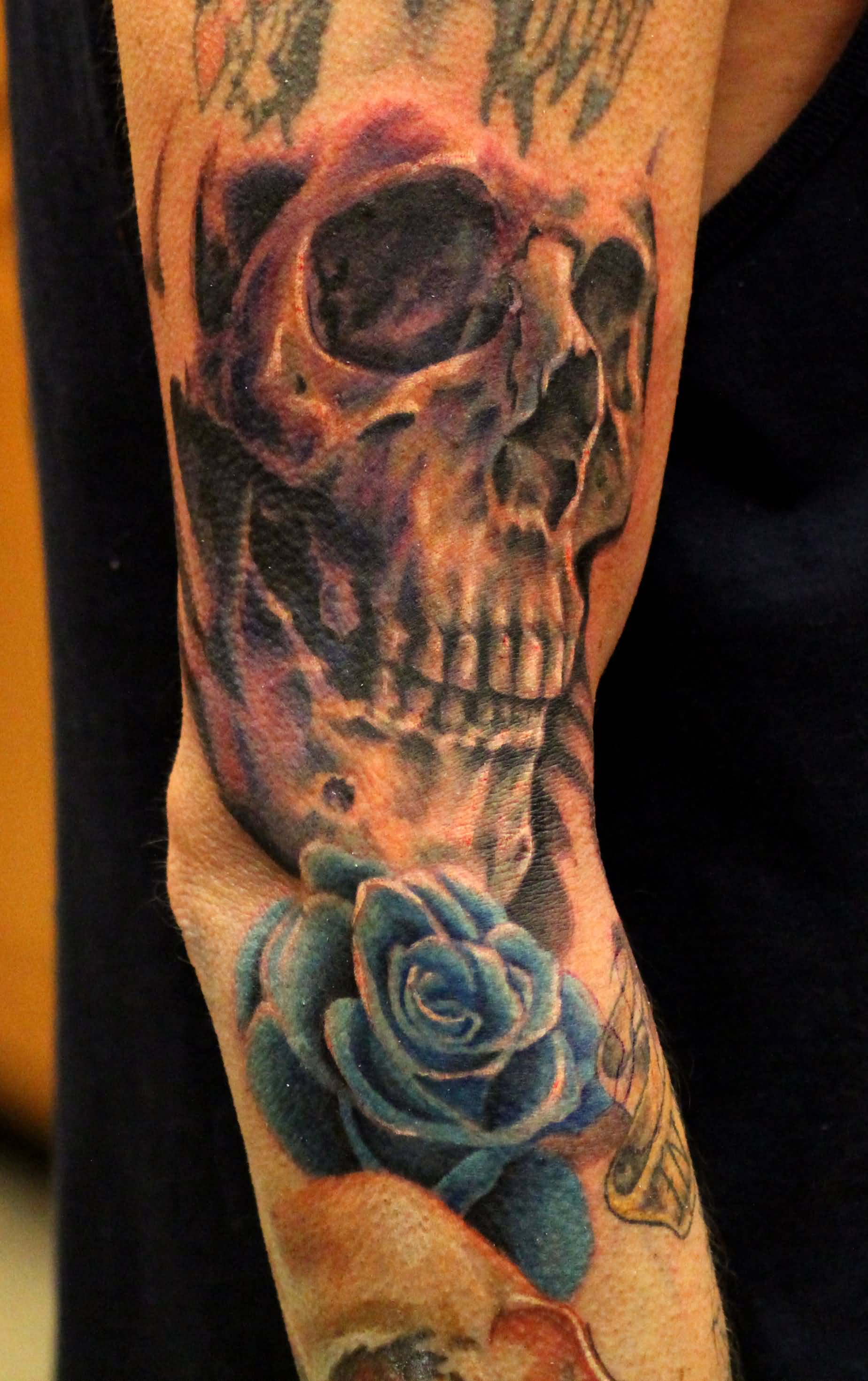 Blue Rose And Skull Tattoo On Sleeve by Ami James