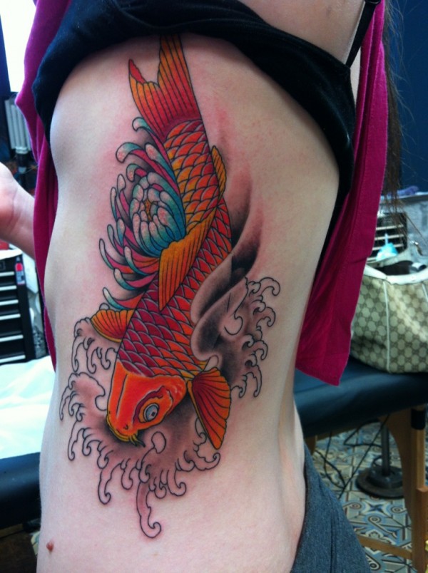 Hibiscus Flower And Koi Fish Tattoo On Side Rib by Ami James