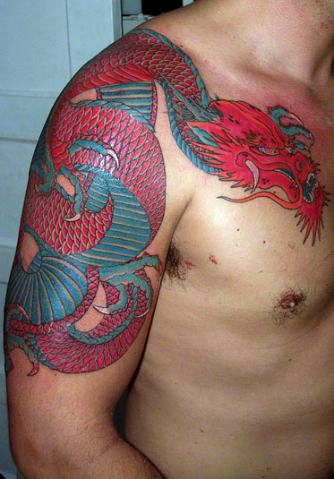 Red Dragon Tattoo On Right Shoulder by Ami James