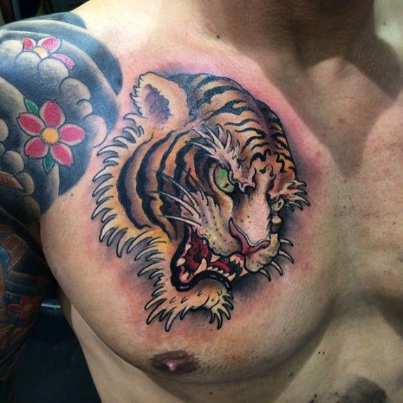 Tiger Head Tattoo On Man Chest by Ami James