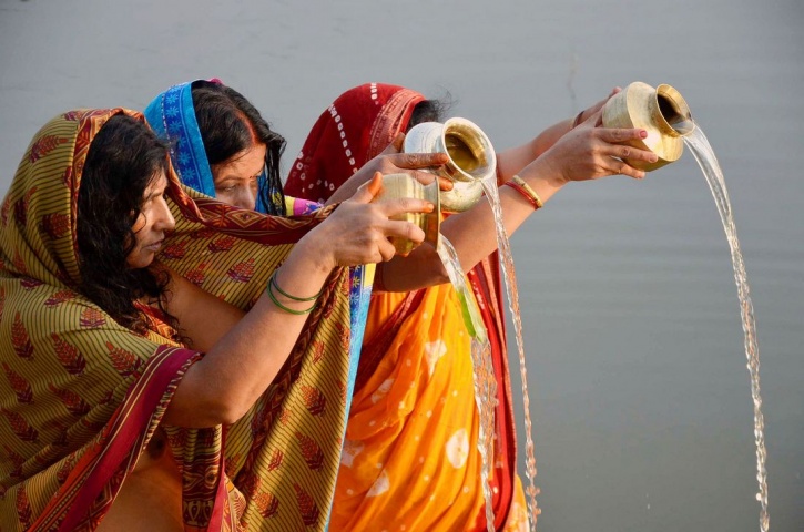 Devotees Worshiping God Sun On Chhath Puja