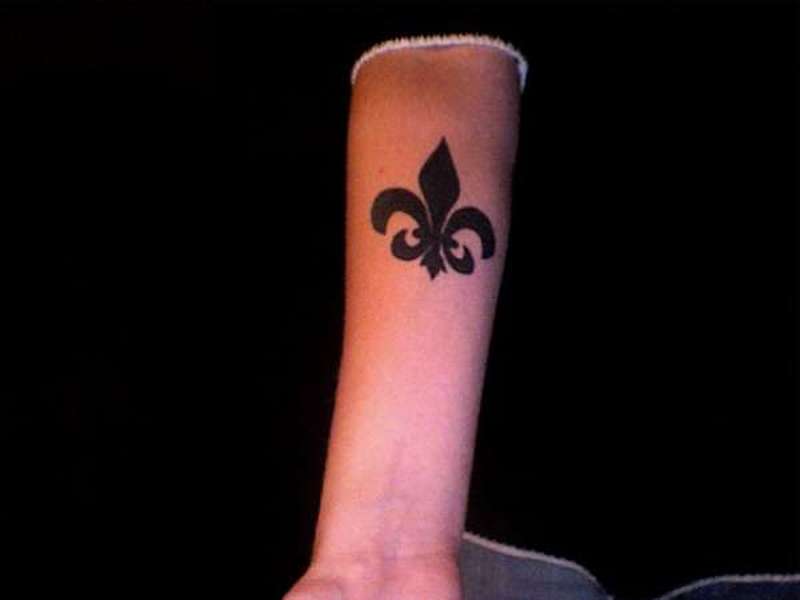 Fleur De Lis Silhouette Tattoo On Forearm