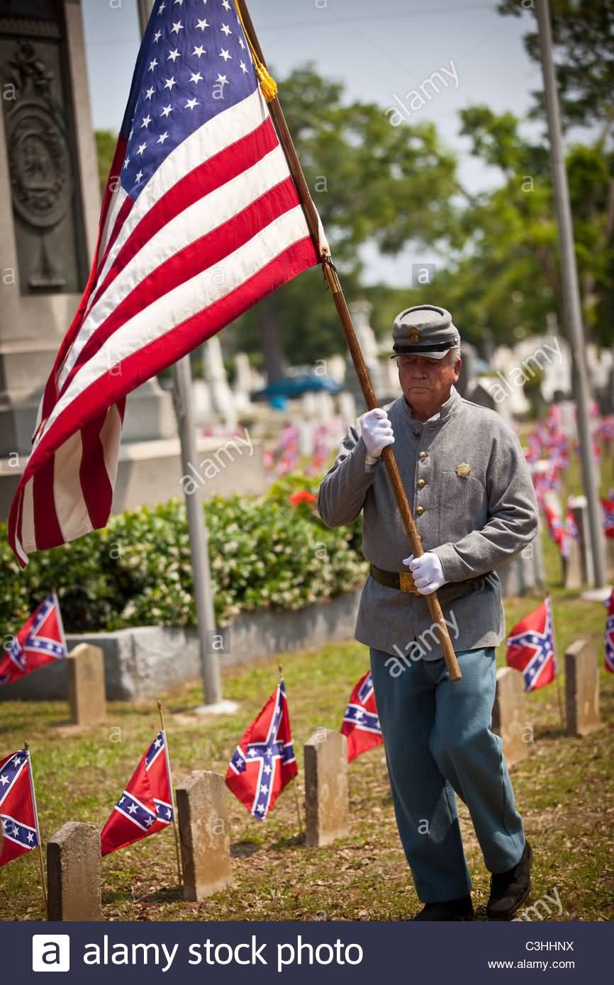 A Confederate Re Enactor With Flag During Confederate Memorial Day Service