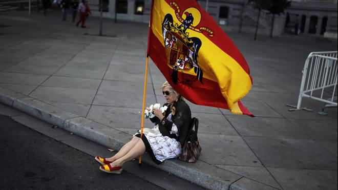 Old Lady With Spain Flag During Spain National Day Celebration