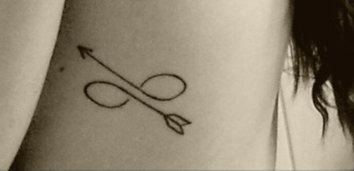 Infinity tattoo with a arrow twist | Arrow tattoos, Infinity arrow tattoo,  Trendy tattoos