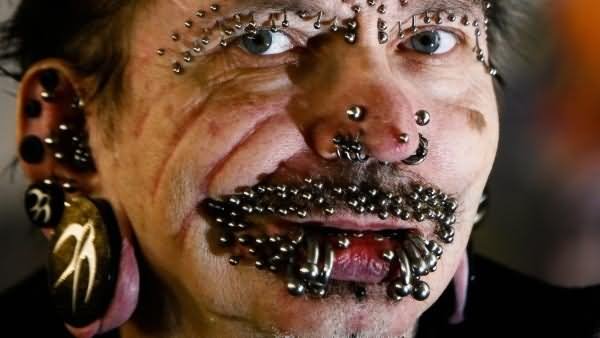 Extreme Crawford Piercing On Face