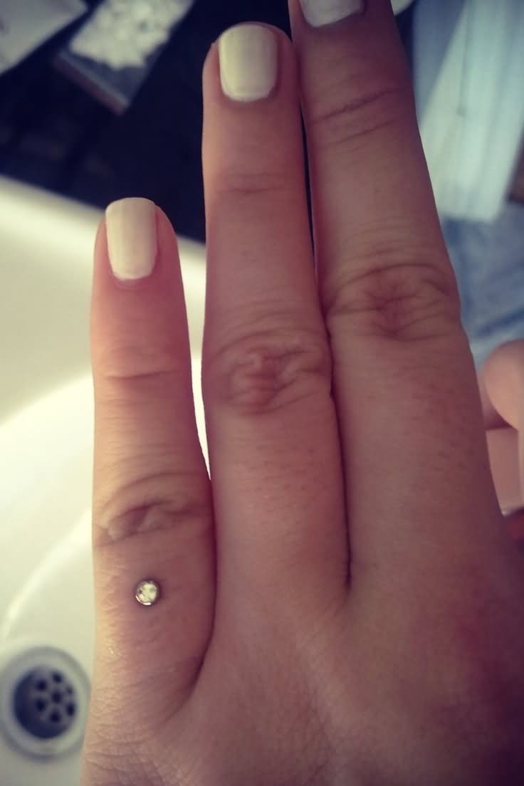 Index Finger Ring Piercing With Tiny Dermal Anchor