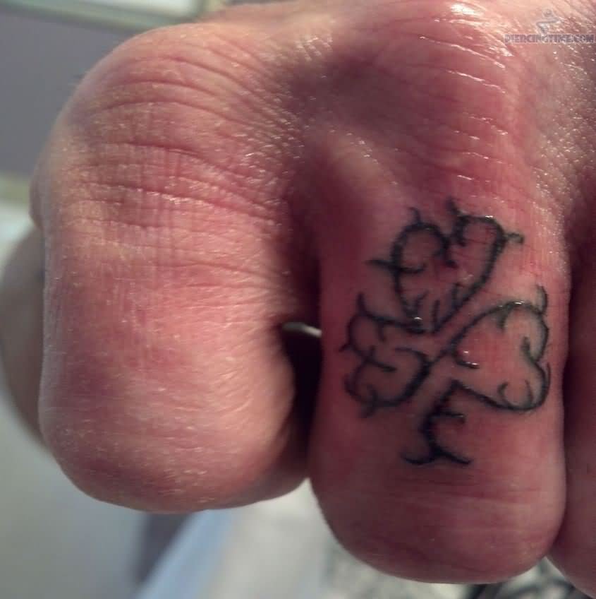 Leaf Tattoo And Finger Ring Piercing