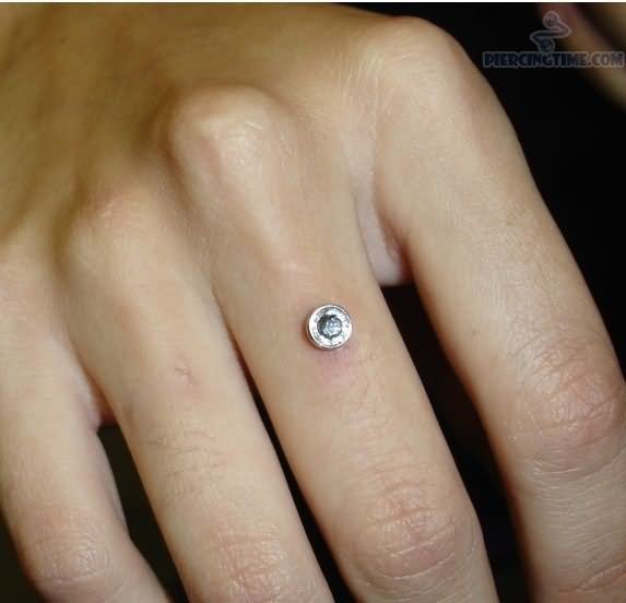 Right Hand Dermal Finger Ring Piercing