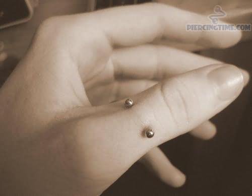 Silver Barbell Finger Piercing