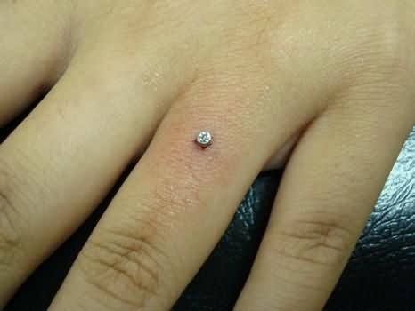 Small Anchor Finger Ring Piercing